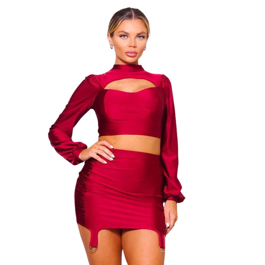Elegant red cutout turtleneck top with a matching ruched mini skirt set, exuding confidence and style, ideal for a night out.