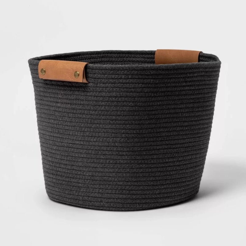 Load image into Gallery viewer, A 13-inch decorative coiled rope basket by Brightroom™ in gray, featuring two brown leather handles with brass metal accents.
