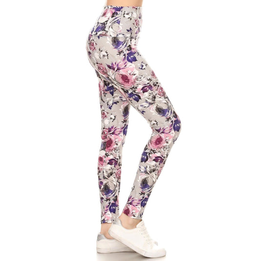 Side view of high-waist yoga leggings showcasing the vibrant floral pattern with shades of pink and purple, perfect for both gym sessions and leisure.