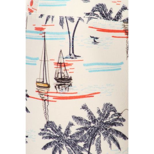 Close-up of the sailor printed knit leggings, showcasing the detailed nautical pattern with palm trees, sailboats, and serene water lines.