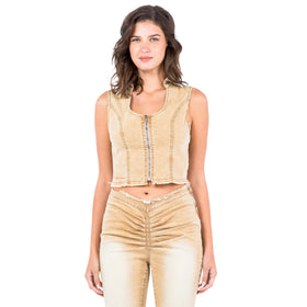 Front-facing full-body image of a model wearing the beige cropped denim vest paired with matching pants, emphasizing the slim fit, raw hem, and zipper closure on the vest.