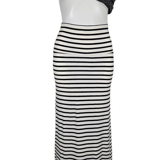 Full-length mannequin wearing a black and white striped maxi skirt, providing a realistic view of the skirt's fit and drape.
