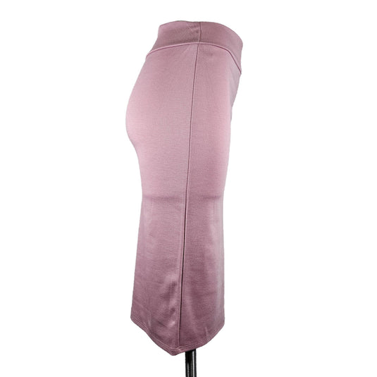 Alternate side view of a coral high-waisted pencil skirt on a display mannequin, focusing on the consistent fit and elegant seam detailing.