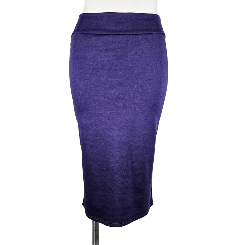 Load image into Gallery viewer, Front view of a purple high-waisted pencil skirt on a mannequin, featuring a rich hue and a form-fitting design.
