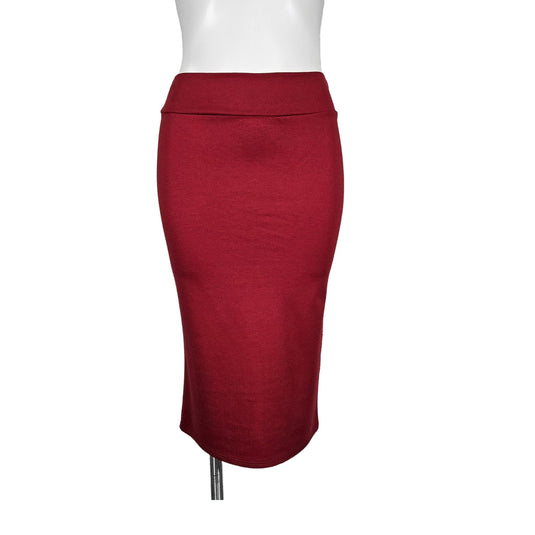 Front view of a red high-waisted pencil skirt on a mannequin, highlighting the garment's rich color and tailored fit.