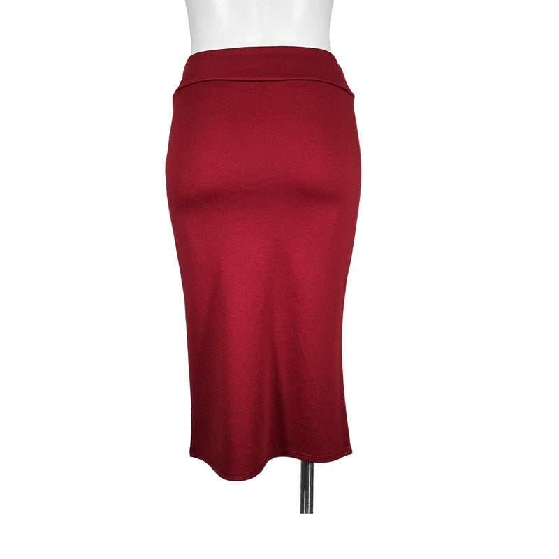 Load image into Gallery viewer, Back view of a red high-waisted pencil skirt on a mannequin, emphasizing the smooth fabric and hidden zipper closure.
