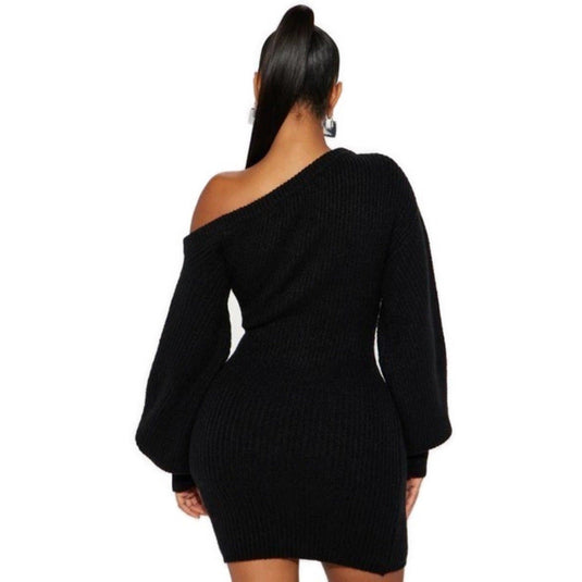 A rear view of a woman wearing a chic black off-shoulder knit mini dress with voluminous long sleeves, presenting a sleek and modern silhouette.