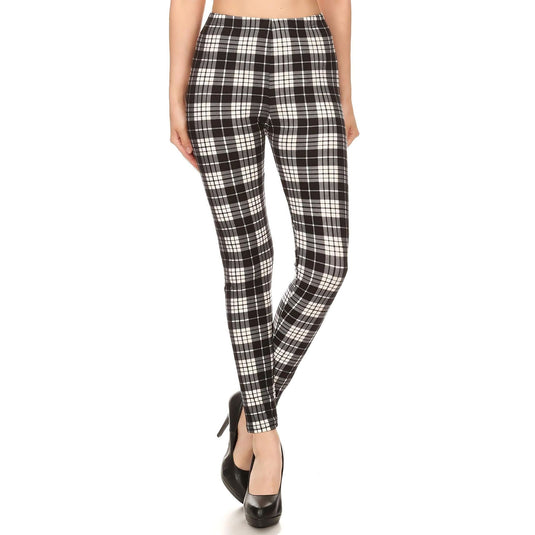 Fashion-forward black and white plaid leggings with a comfortable high waist, paired with classic black pumps for a sophisticated look.