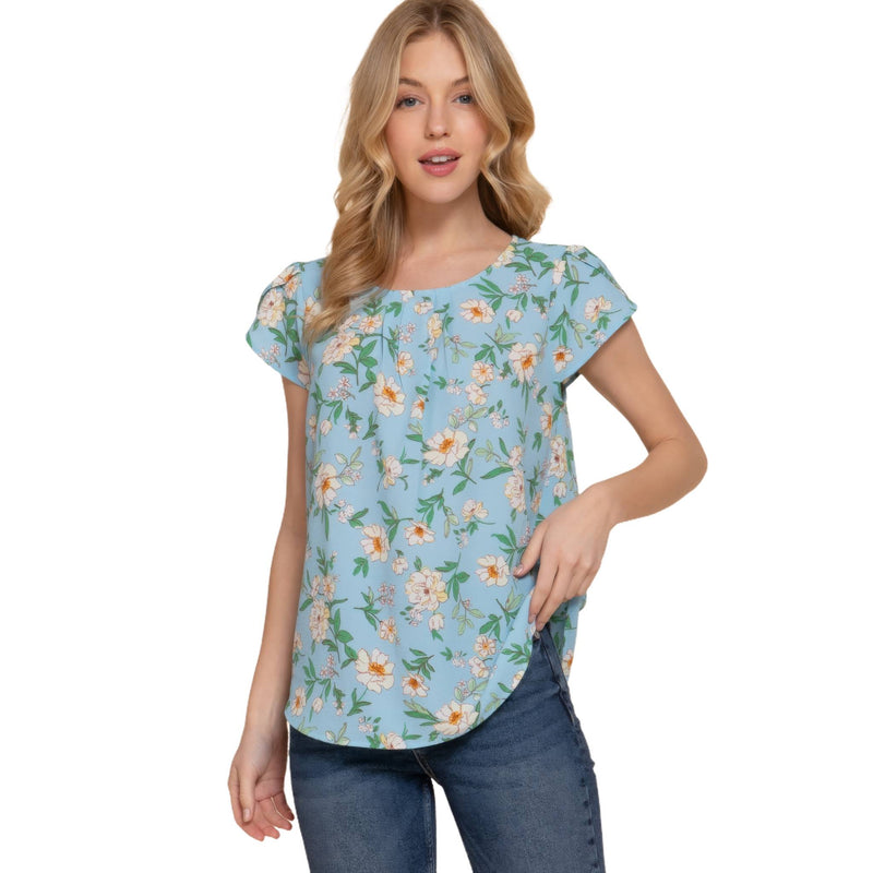 Load image into Gallery viewer, Elegant model wearing a light blue floral top with short tulip sleeves, showcasing a round neck and a comfortable fit.
