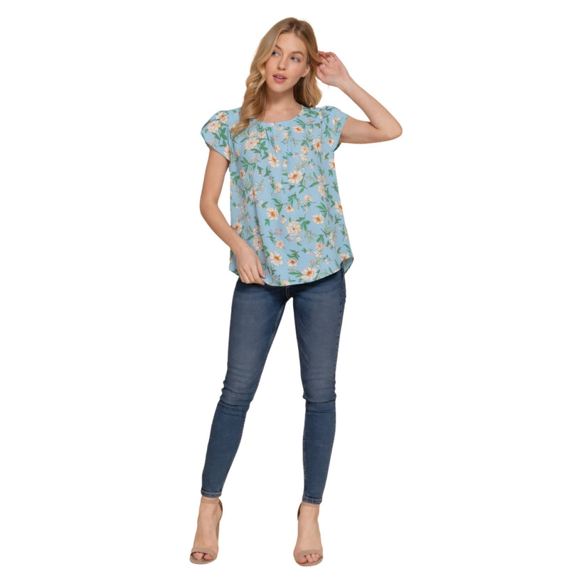 Load image into Gallery viewer, Full-body shot of a woman in a serene blue floral woven top paired with slim-fitting jeans, exuding casual elegance.
