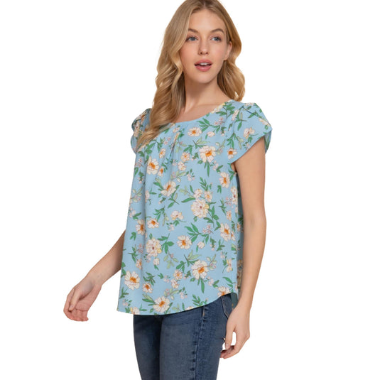 Fashionable short tulip sleeve top in light blue with a delicate floral pattern, perfect for spring and summer.