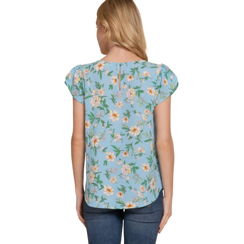 Load image into Gallery viewer, Rear view of a floral tulip sleeve top in light blue, focusing on the subtle details and soft flow of the fabric.

