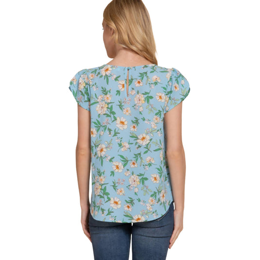 Rear view of a floral tulip sleeve top in light blue, focusing on the subtle details and soft flow of the fabric.