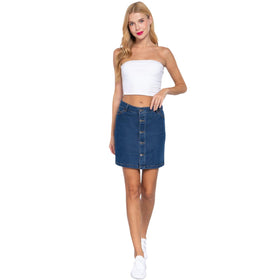 Casual-chic button-front denim mini skirt on a model, featuring a snug waist and a straight-cut silhouette, paired with a white strapless crop top and white sneakers.