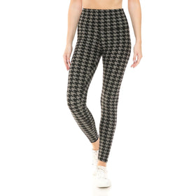 Chic black and taupe houndstooth high-waist yoga leggings paired with crisp white sneakers for a trendy, athletic look.