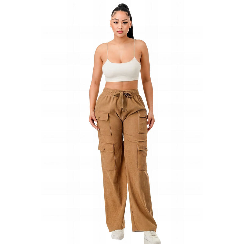 Load image into Gallery viewer, Confident woman in khaki corduroy cargo pants paired with a white cropped tank top, showcasing a relaxed yet chic streetwear ensemble.

