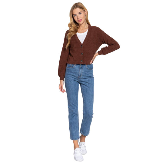 Full view of brown sweater cardigan and denim outfit.