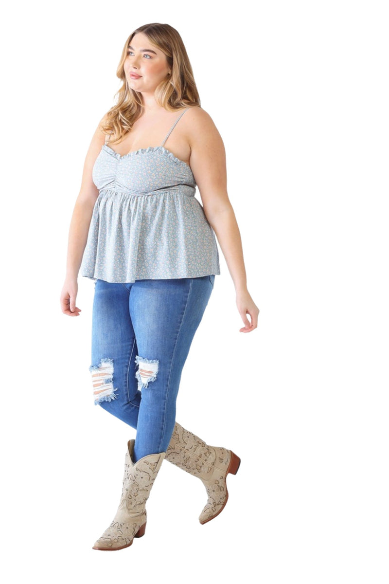 Load image into Gallery viewer, Back view of a plus-size model in a blue floral smocked cami, focusing on the smocked back detail and relaxed, flowy silhouette.
