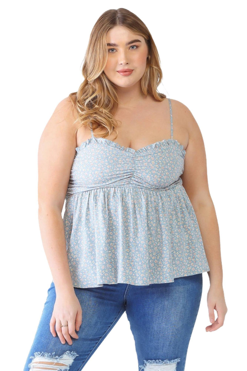 Load image into Gallery viewer, Plus-size model in a blue floral smocked sweetheart neck cami and distressed jeans, paired with cowboy boots, showcasing a casual, stylish look.
