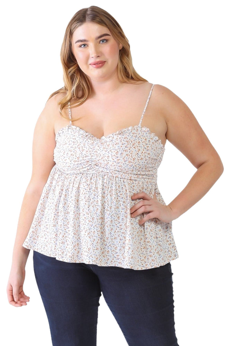 Load image into Gallery viewer, Close-up of a plus-size model wearing a floral smocked sweetheart neck cami, showcasing the ruffled neckline and adjustable spaghetti straps.
