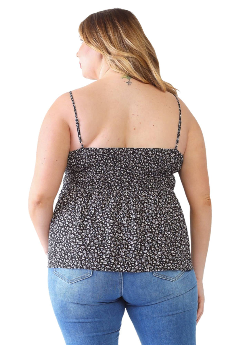 Load image into Gallery viewer, Back view of a plus-size model in a black floral smocked sweetheart neck cami, emphasizing the smocked back and adjustable straps.
