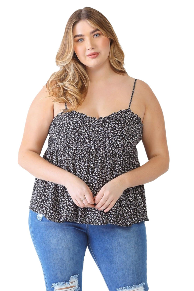 Load image into Gallery viewer, Plus-size model in a lavender floral smocked sweetheart neck cami, paired with distressed jeans and cowboy boots, ideal for a chic casual look.
