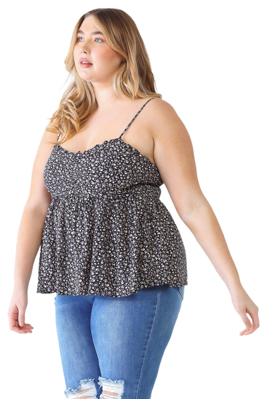 Plus-size model wearing a black floral smocked sweetheart neck cami, highlighting the ruffled neckline and ruching detail at the bust.