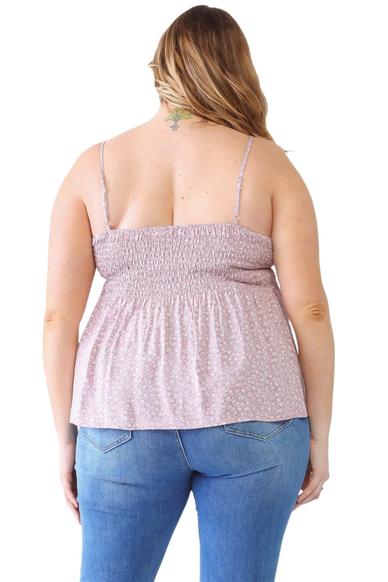 Load image into Gallery viewer, Back view of a plus-size model wearing a lavender floral smocked cami, showcasing the smocked back and flowy peplum design.
