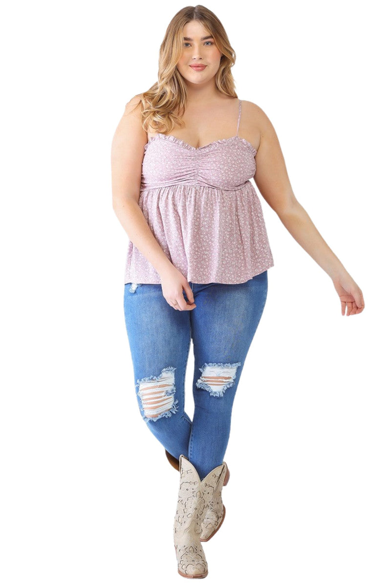 Load image into Gallery viewer, Plus-size model in a lavender floral smocked sweetheart neck cami, paired with distressed jeans and cowboy boots, ideal for a chic casual look.
