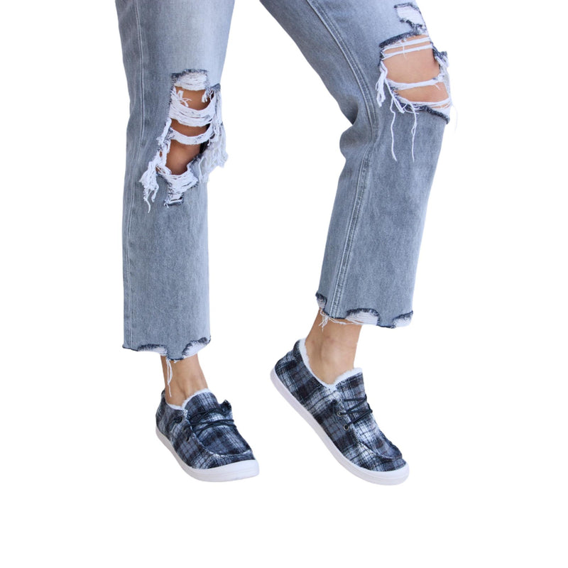 Load image into Gallery viewer, A front view showing the plaid sneakers and ripped gray jeans, focusing on the frayed details and shoes.
