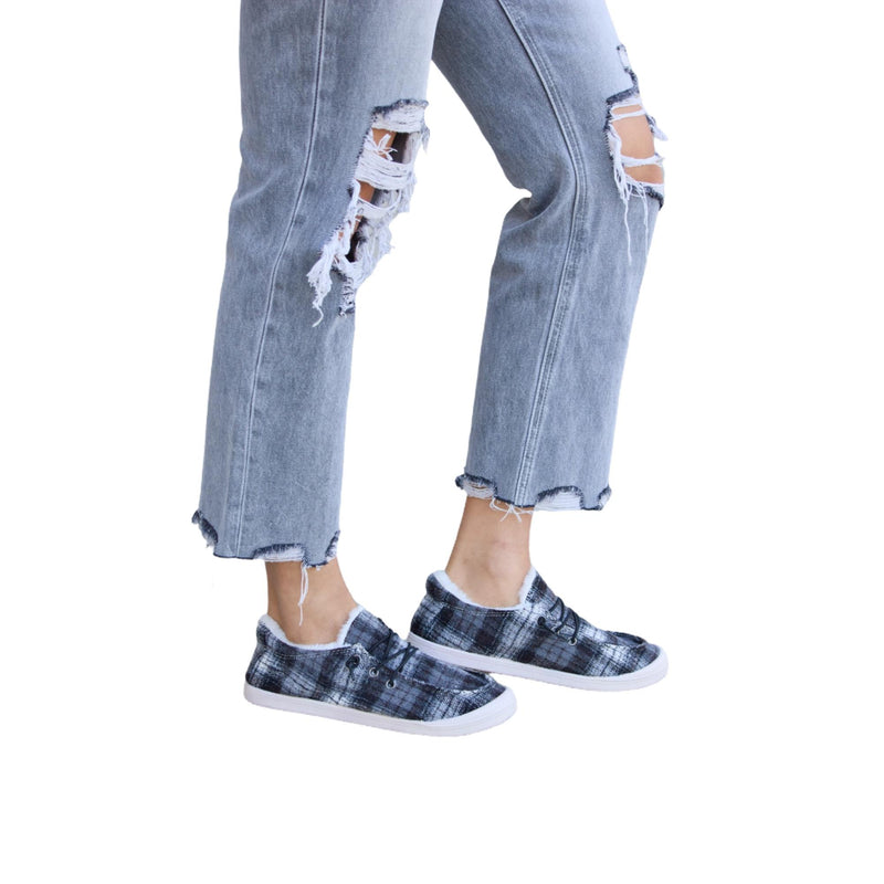 Load image into Gallery viewer, A side view of the same outfit, showcasing the plaid sneakers and ripped denim
