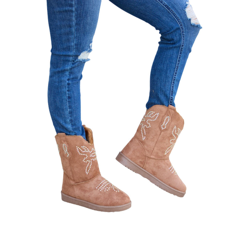 Load image into Gallery viewer, Side view of brown rhinestone-studded furry boots paired with blue ripped jeans.
