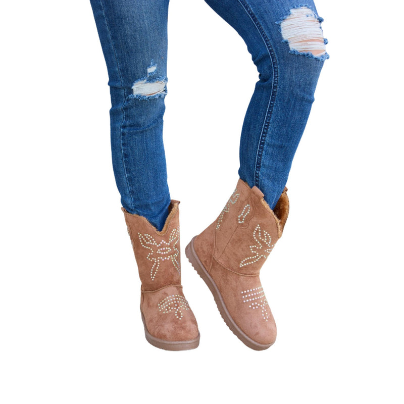 Load image into Gallery viewer, Front view of rhinestone-decorated brown furry flat boots styled with blue ripped jeans.
