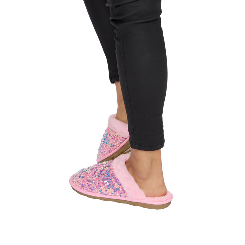 Load image into Gallery viewer, Side profile of pink sequin slippers with a plush lining, showing the flat sole and comfortable, slip-on style design.
