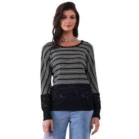 Frontal view of a stylish black sweater featuring golden glitter stripes and intricate black crochet lace at the bottom, modeled with a confident smile.