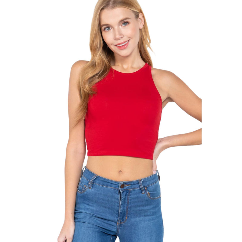 Load image into Gallery viewer, The image features a woman posing in a sleeveless red crop top with blue jeans against a plain background. The crop top has a high neckline and provides a bold pop of color that stands out.
