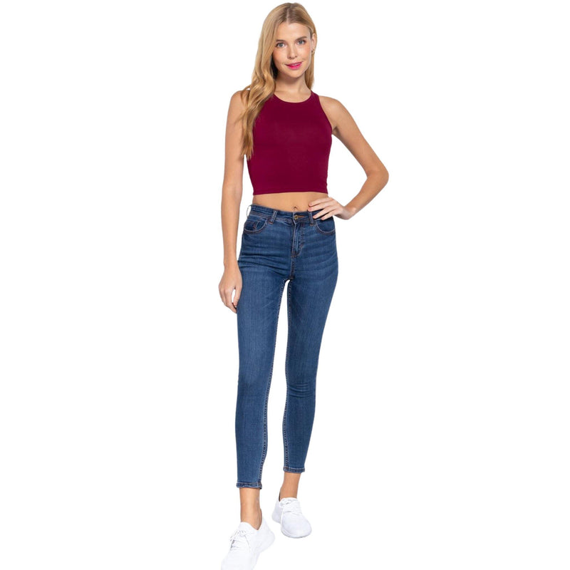 Load image into Gallery viewer, Full body view of a model wearing a rich burgundy crop top and denim jeans, complemented by white sneakers for a day out.
