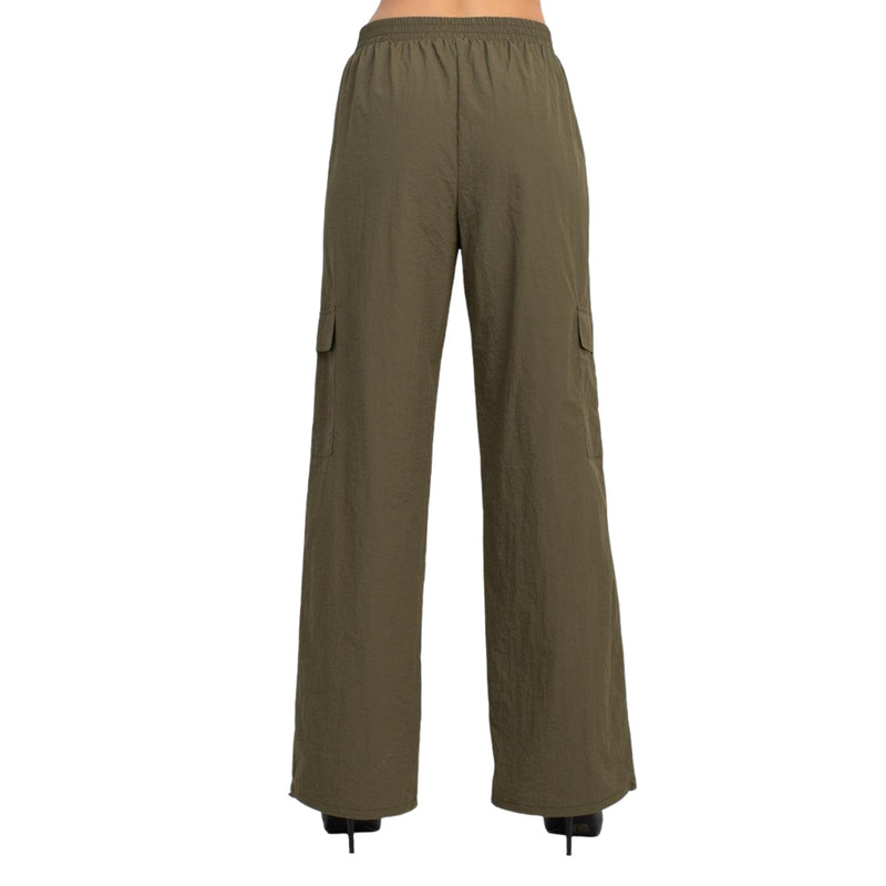 Load image into Gallery viewer, Back view of olive green high-rise cargo parachute pants with an elastic waistband. The pants feature a relaxed fit and multiple pockets, perfect for a comfortable and functional everyday look.
