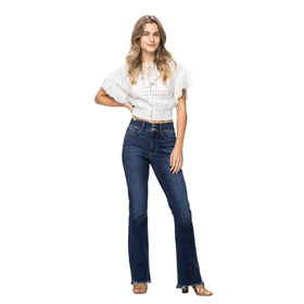 Model wearing Judy Blue Frayed Hem Bootcut Denim Jeans paired with a white top, showcasing the versatile and flattering fit.