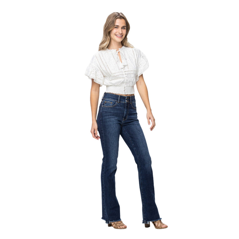 Load image into Gallery viewer, Model wearing Judy Blue Full Size Frayed Hem Bootcut Jeans paired with a white top, demonstrating the stylish and versatile fit.
