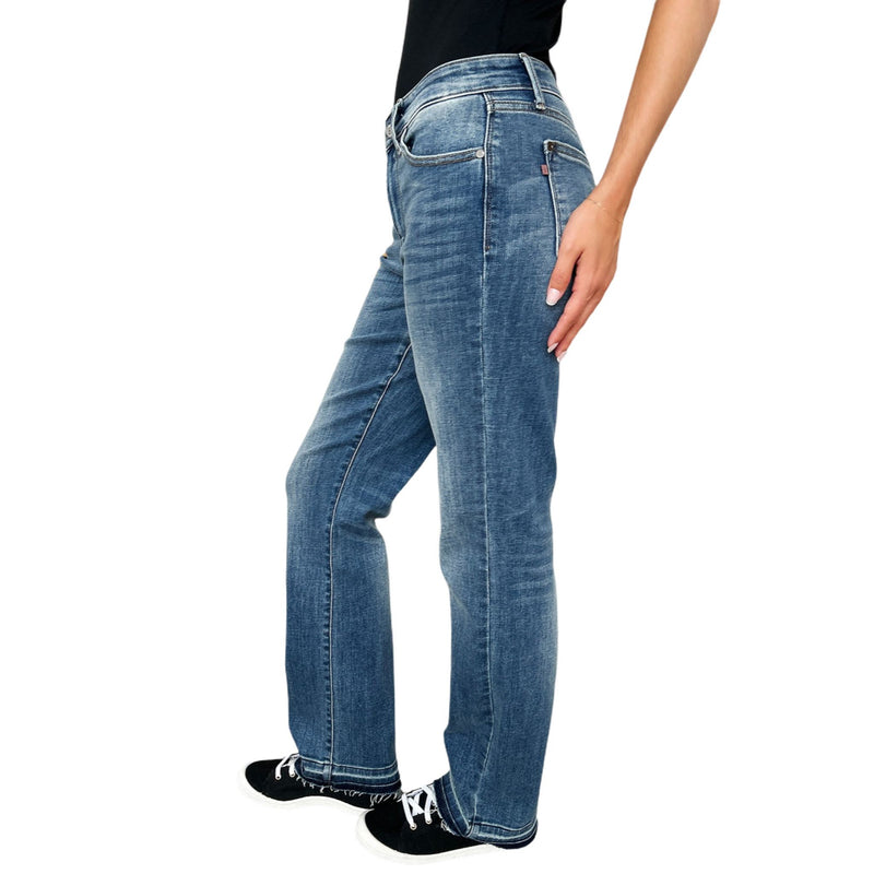 Load image into Gallery viewer, Woman stretching Judy Blue Full Size Mid Rise Release Hem Jeans to demonstrate the flexibility and comfort of the denim.
