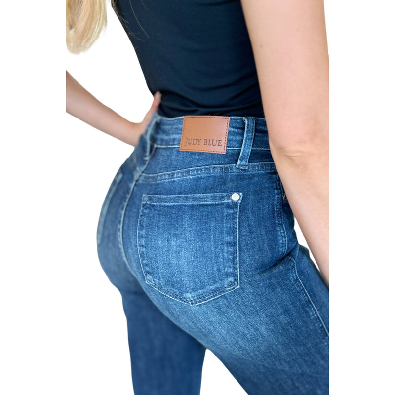 Load image into Gallery viewer, Close-up of Judy Blue Full Size Tummy Control Straight Jeans back pocket with branded leather patch, emphasizing fit.
