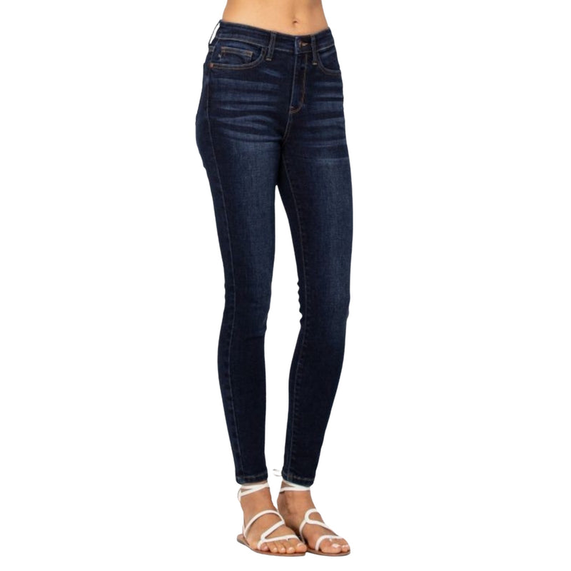 Load image into Gallery viewer,  Close-up view of the Classic High Waist Skinny Jeans in dark wash, highlighting the high waist design and skinny fit.
