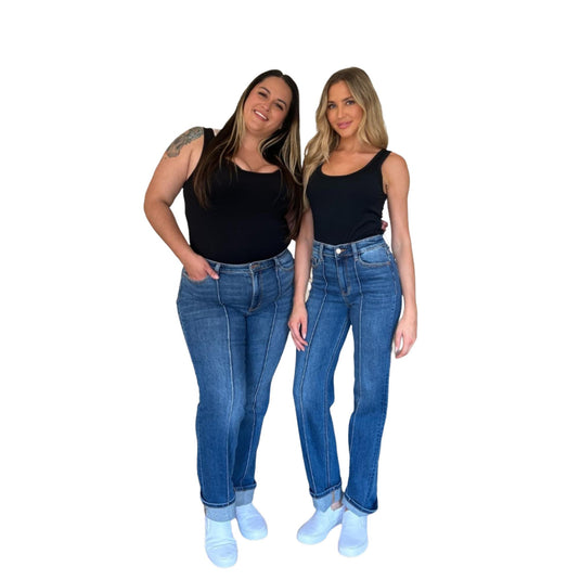 Two women smiling and posing side by side, both wearing the High Waist Front Seam Detail Straight Jeans with black tops and white sneakers, showcasing the versatility of these jeans for various body types.