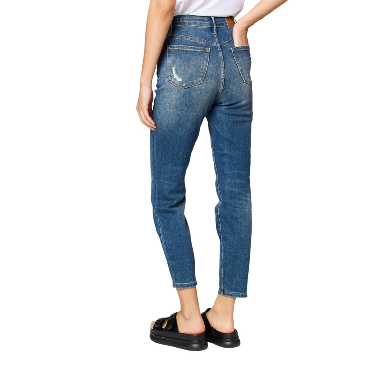 Load image into Gallery viewer, The back of the high-waisted blue jeans with subtle distressing on the back pocket and a faded wash down the legs.
