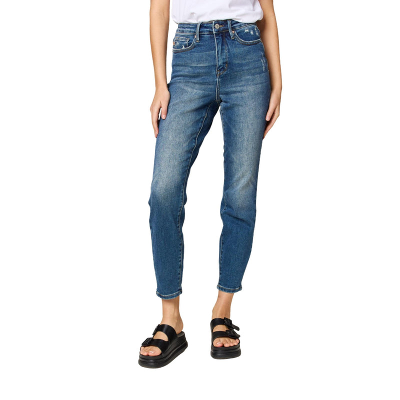 Load image into Gallery viewer, A full-body shot of the model in blue high-waisted jeans paired with black platform sandals and a white t-shirt.
