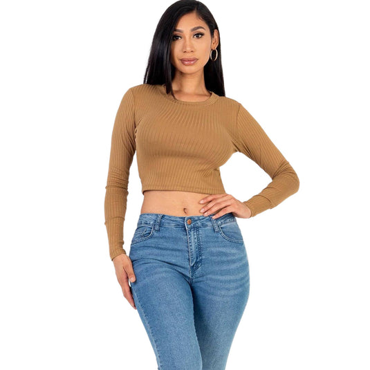 Model posing in a camel-colored ribbed long-sleeve crop top, perfectly complementing her blue denim for a timeless fashion statement.