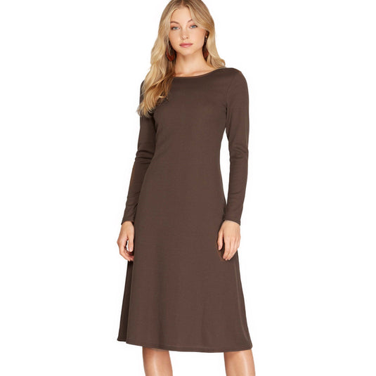 Warm brown long sleeve midi dress displaying a comfortable knit structure, a round neckline, and a subtly flared hem, exemplifying casual elegance.