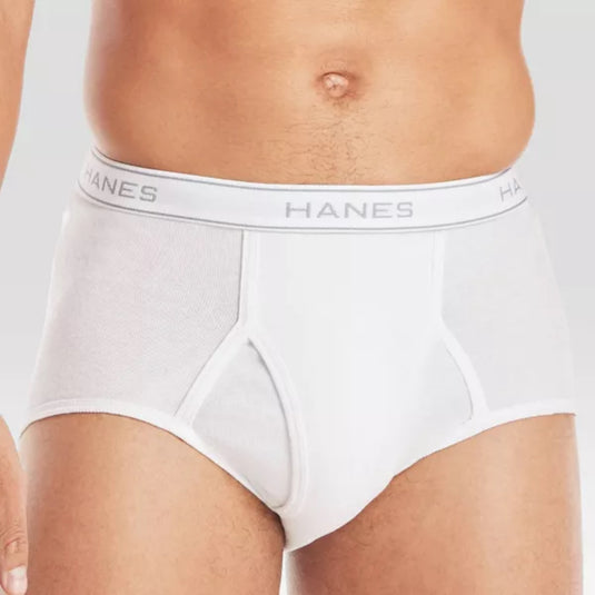 Close-up view of a man’s midsection wearing white Hanes tagless briefs, showing the waistband and front design.
