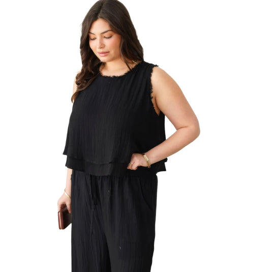A casual yet stylish black sleeveless top with frayed accents, perfect for a versatile summer wardrobe.